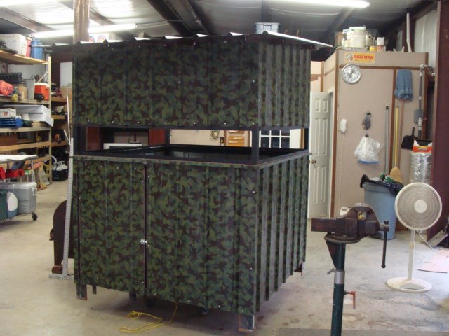 A camouflaged shed in a garage.